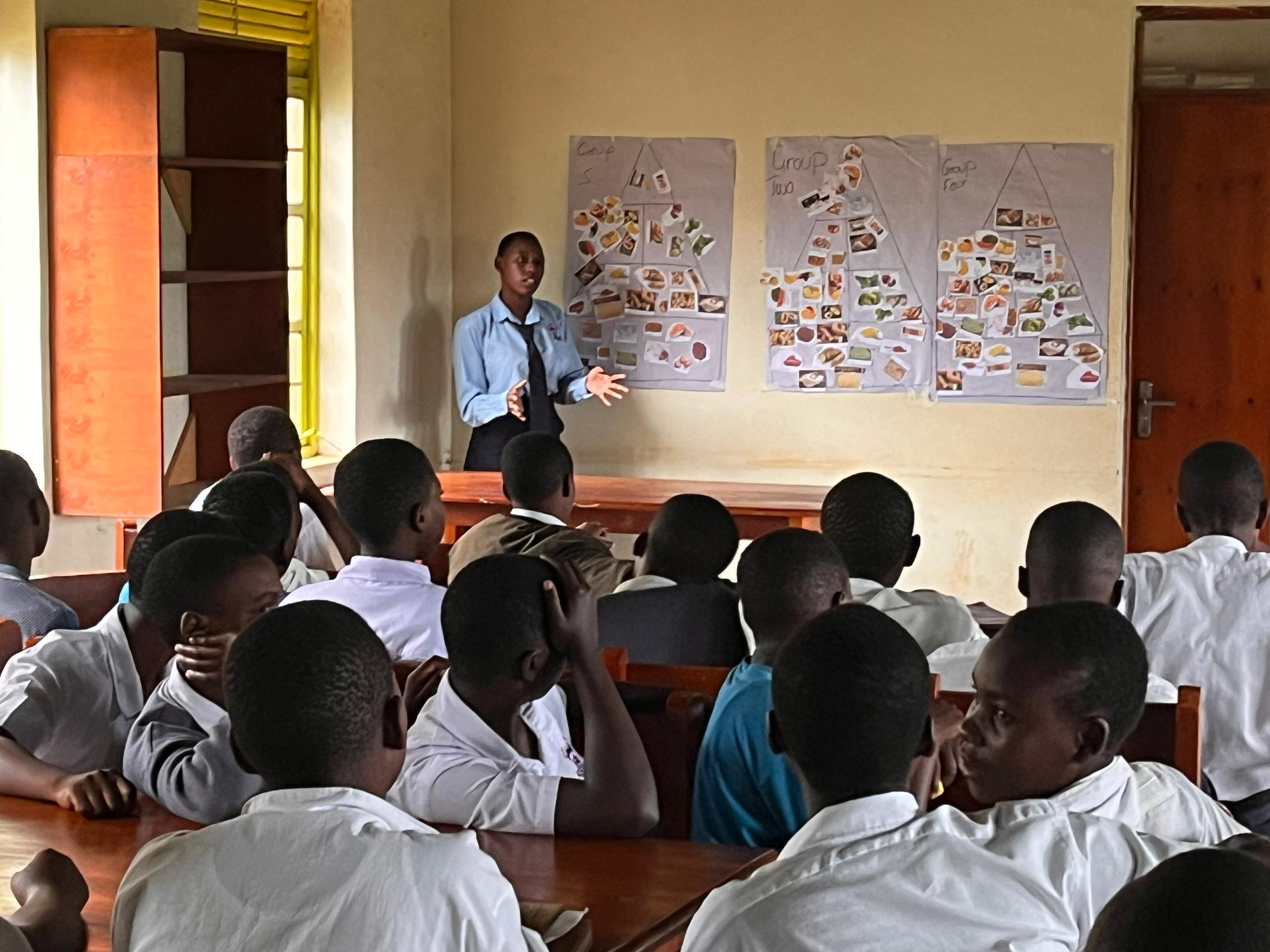 Students making food pyramids in … secondary school